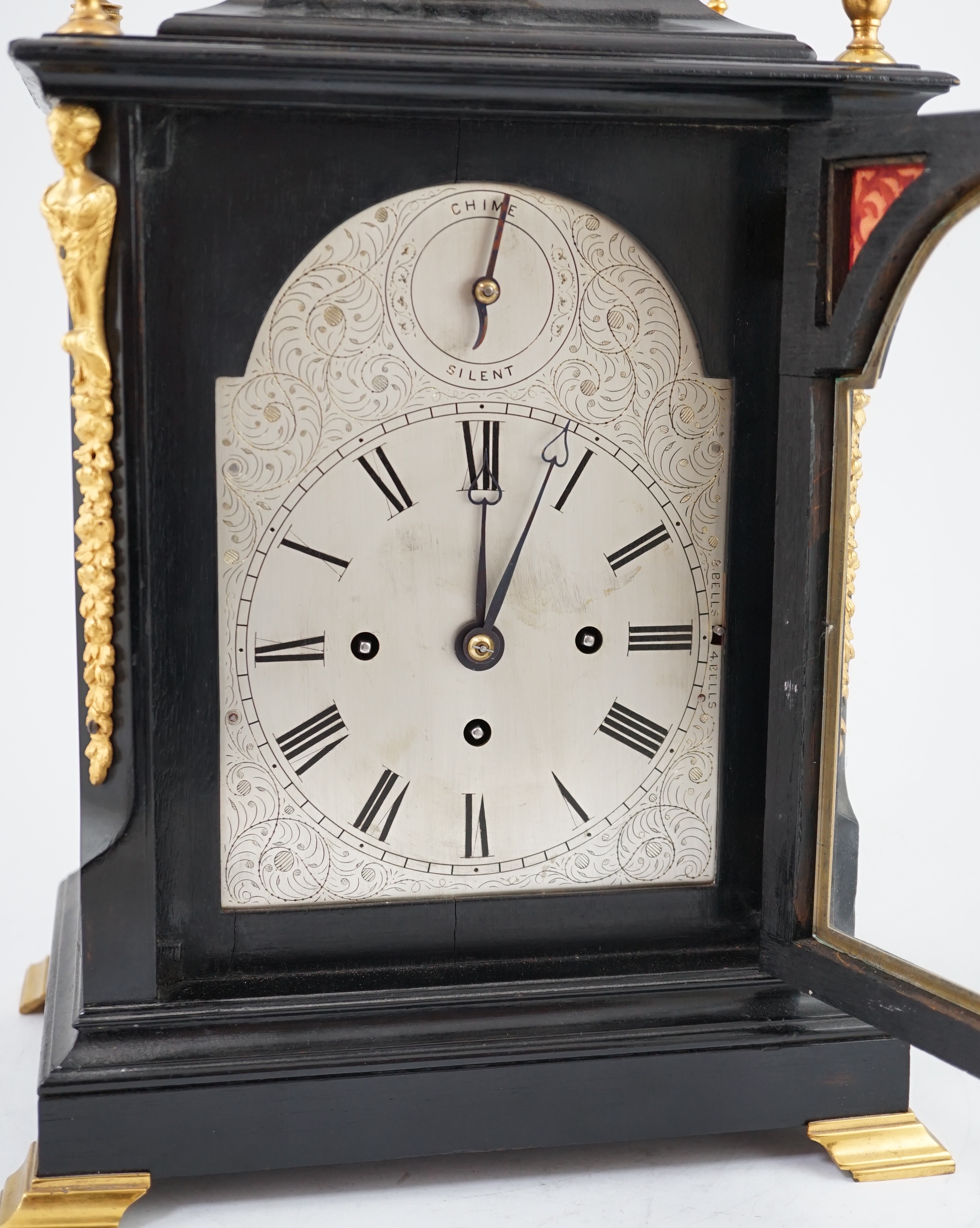 A Victorian ormolu mounted ebonised chiming bracket clock